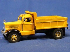 White WC Yellow Dump Truck
