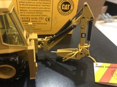 NZG #378 CAT Caterpillar 428 Backhoe Loader w/ Hammer – 1:50 – Limited Edition