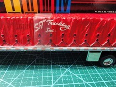 DCP 1:64 S&T Trucking Inc Red Peterbilt Tractor Trailer Used Box
